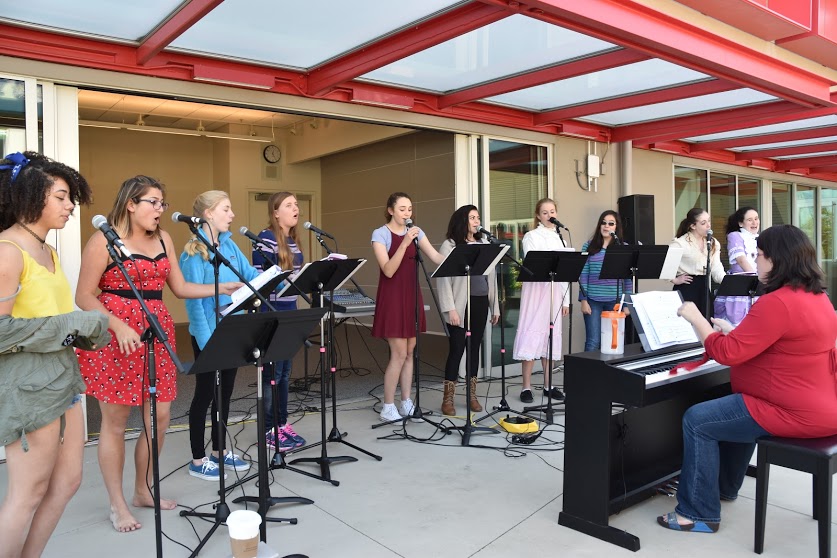 Soundwaves sings for a crowd of students during lunch.