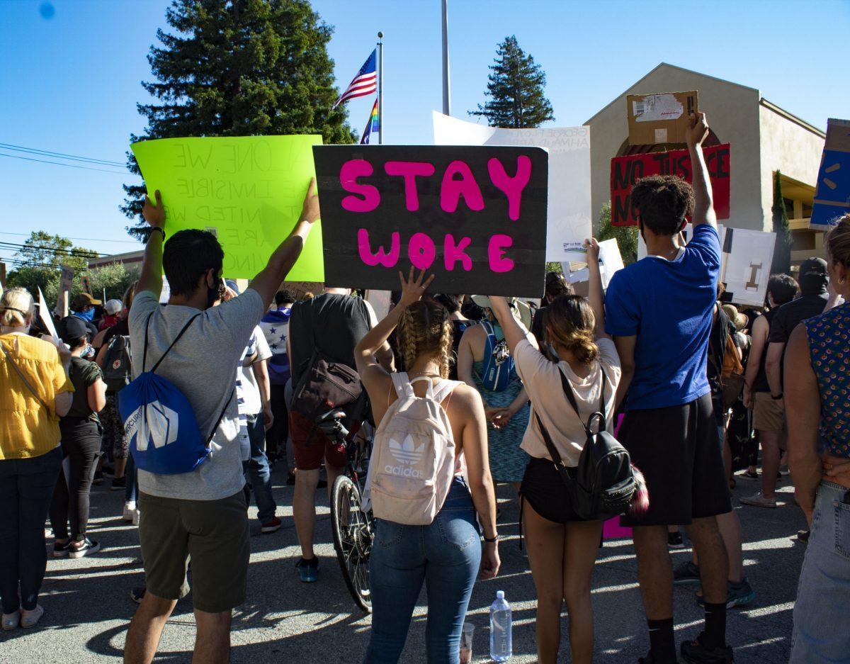 Teens hold up signs during a San Mateo Black Lives Matter protest in front of San Mateo City Hall.
Photo by Willow Taylor C. Y. 