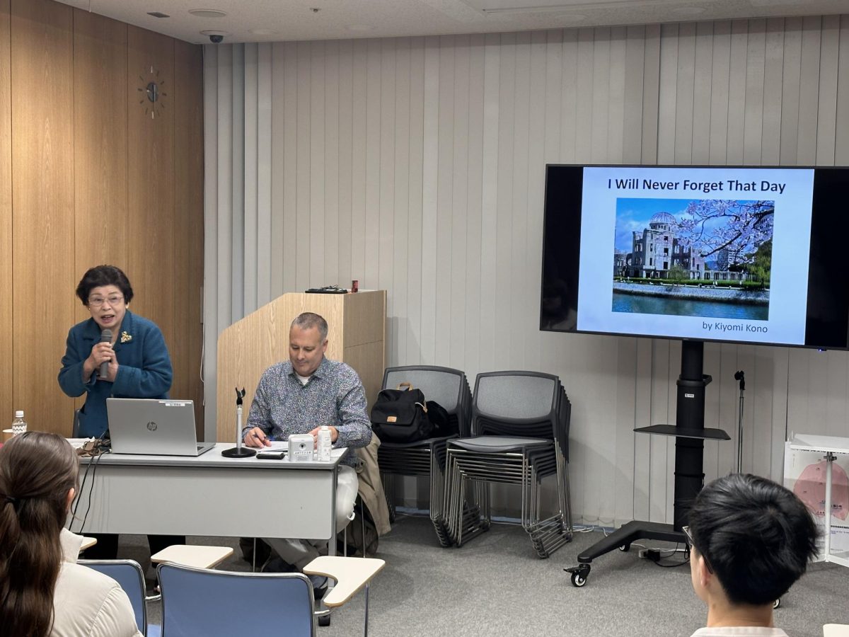 Kiyomi Kono delivers her presentation as Japanese teacher Chris Scott translates.