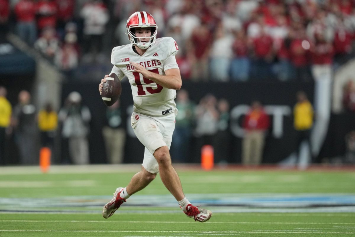 Dec 6, 2025; Indianapolis, IN, USA; Indiana Hoosiers quarterback Fernando Mendoza (15) looks to pass in the second half against the Ohio State Buckeyes during the 2025 Big Ten championship game at Lucas Oil Stadium. Mandatory Credit: Aaron Doster-Imagn Images