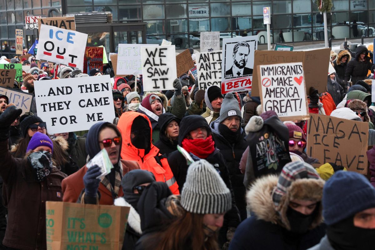 People take part in a demonstration a day after a man identified as Alex Pretti was fatally shot by federal immigration agents trying to detain him, in Minneapolis, Minnesota, U.S., January 25, 2026. REUTERS/Shannon Stapleton