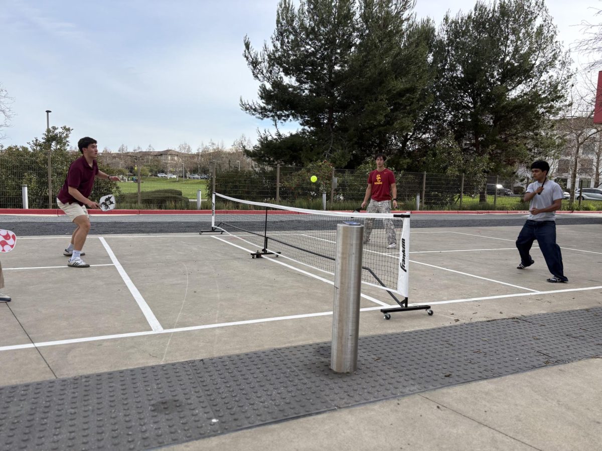 Seniors play pickleball on the Cafe Courtyard.