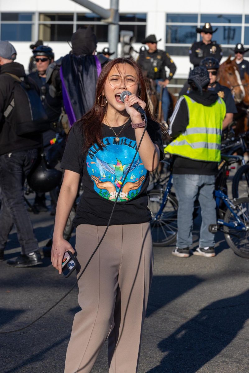 Kimberly Woo speaks against the presence of ICE at Super Bowl LX. 
// CREDIT: ProBonoPhoto.org / John Weekes. The photographer retains copyright to the images. This is a CC-NC-BY-4.0 license:
https://creativecommons.org/licenses/by-nc/4.0/ 