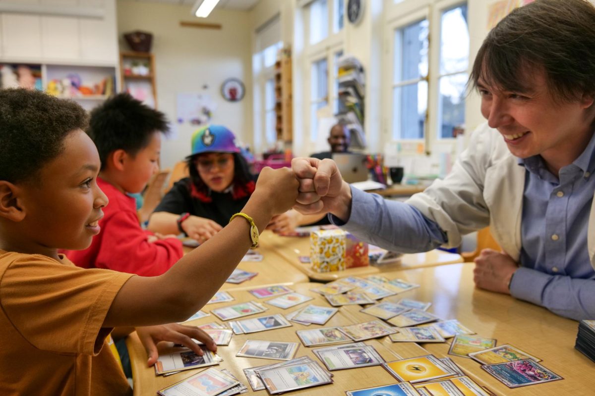 Take a Pikachu: Wesley S. '35 and Pokemon Professor Frank Luciano celebrated after Wesley made a successful move.