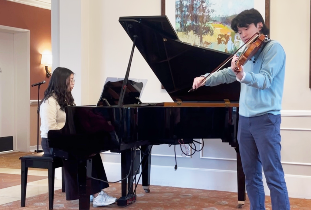 A Spirited Duet - Tin K. '27 and Edden L. '26 perform a Christmas special at Oakmont.