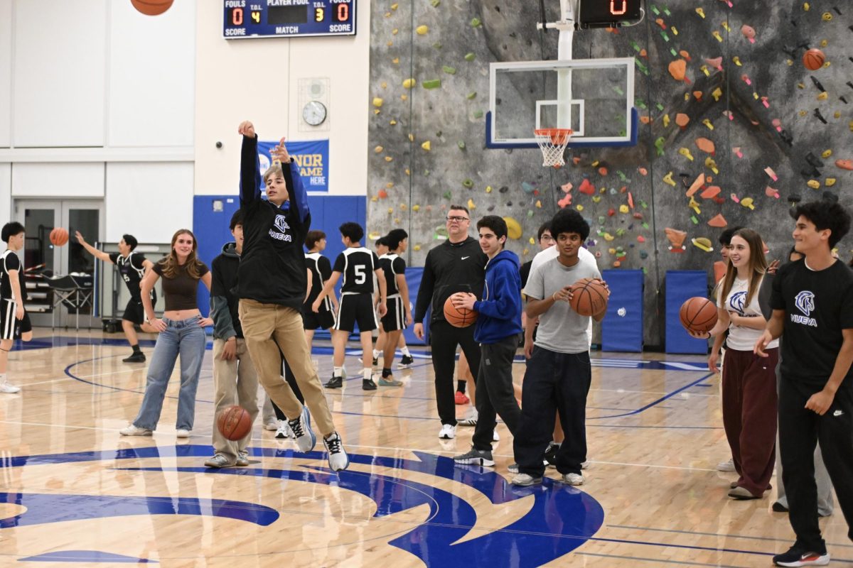 Students compete together in the halftime competition.