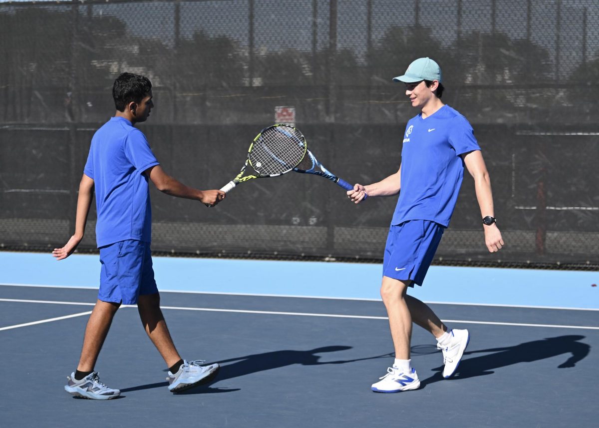 Racket Tap // Jackson A. ’27 and Aanik C. ’29 congratulate each other with their rackets.