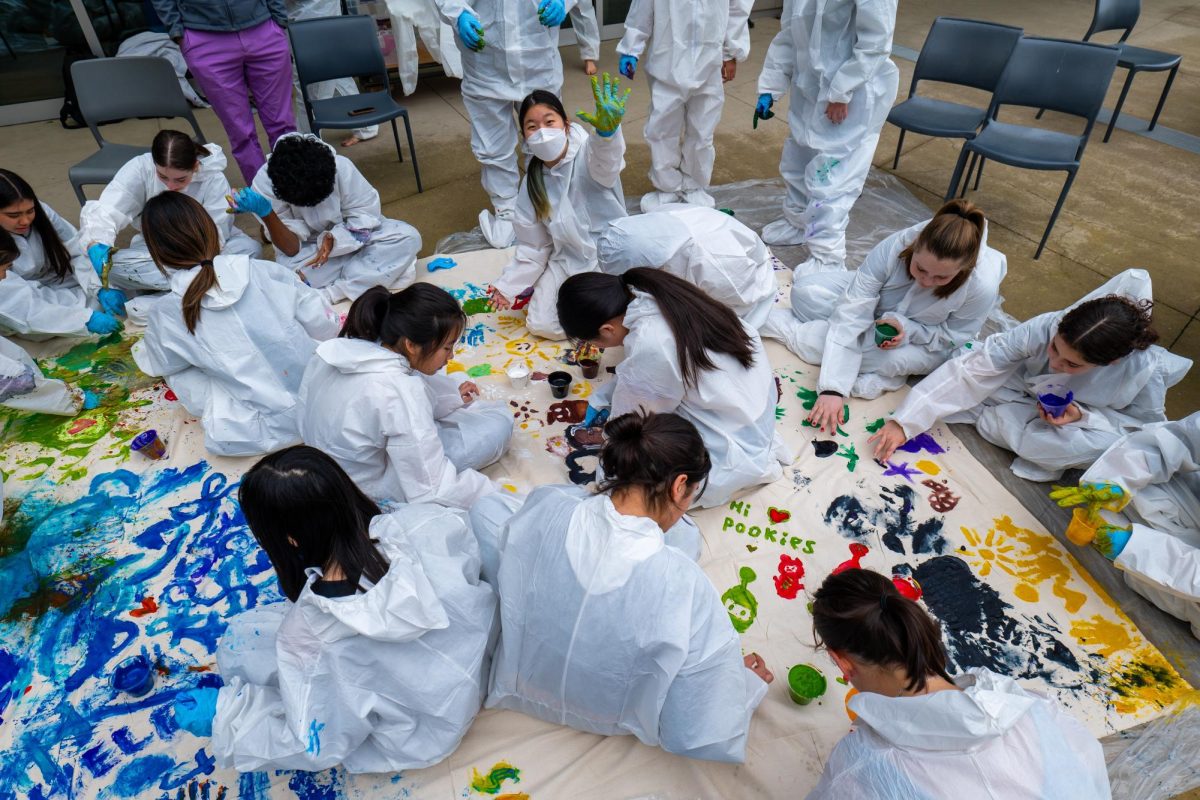 Color Craze: During an afternoon debrief workshop students geared up in disposable smocks and participated in a paint party.